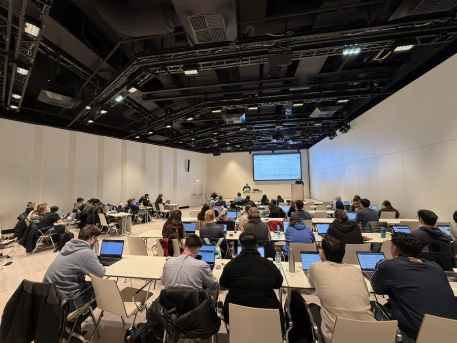 room with seated people in a session