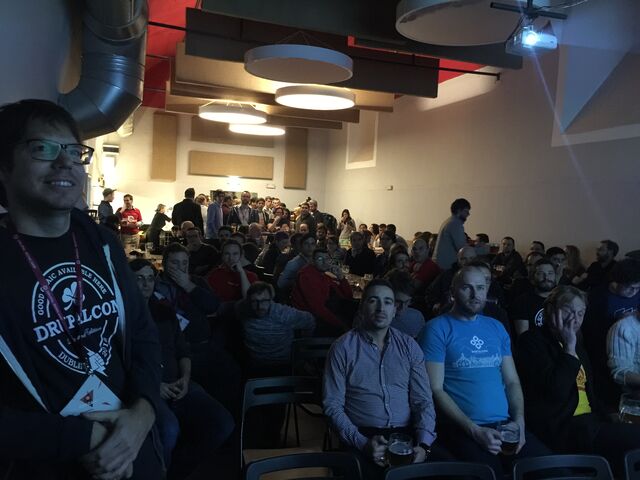 people seated waiting for screening