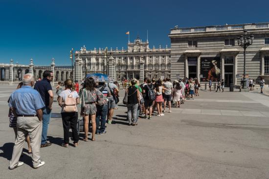 People waiting in line for paying entry